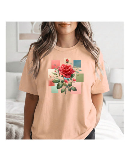a beige t-shirt with a colorful rose design 