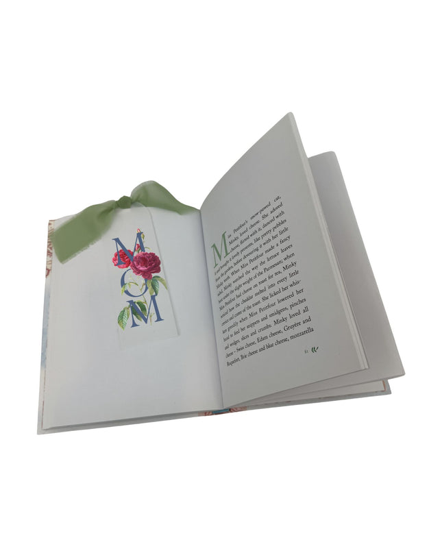Open book with floral design on a white background