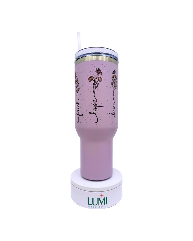 Pink tumbler with floral design and 'Lumi' branding on a white background