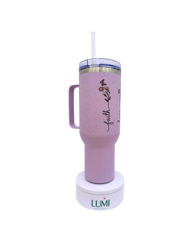 Purple tumbler with handle and straw lid on a white background