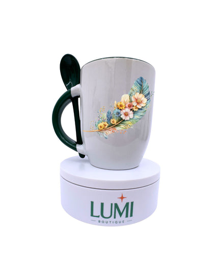 Mug with floral design on a white background, featuring the LUMI Boutique logo.