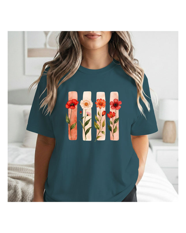 a teal t-shirt with floral design 