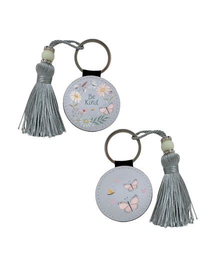 Two keychains with tassels on a white background