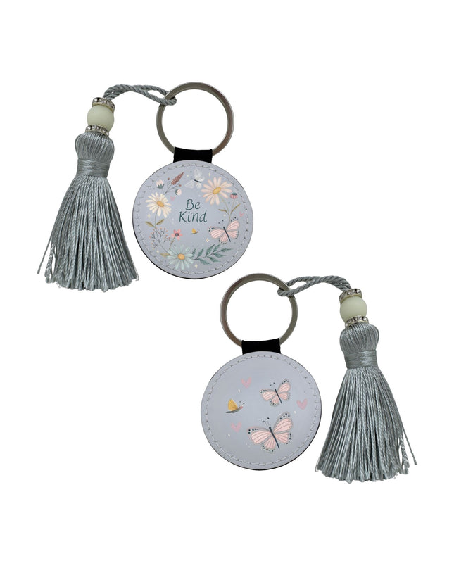 Two keychains with tassels on a white background