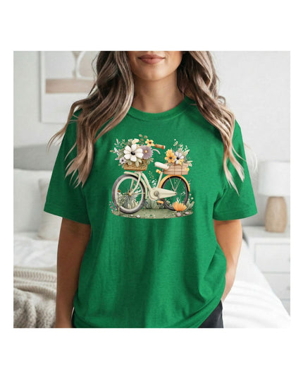 Person wearing a green t-shirt with a bicycle and flower design.