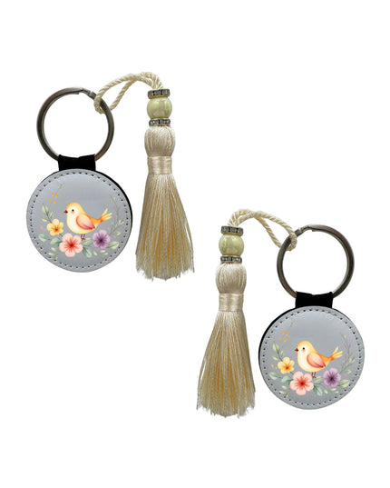 Two keychains with tassels on a white background