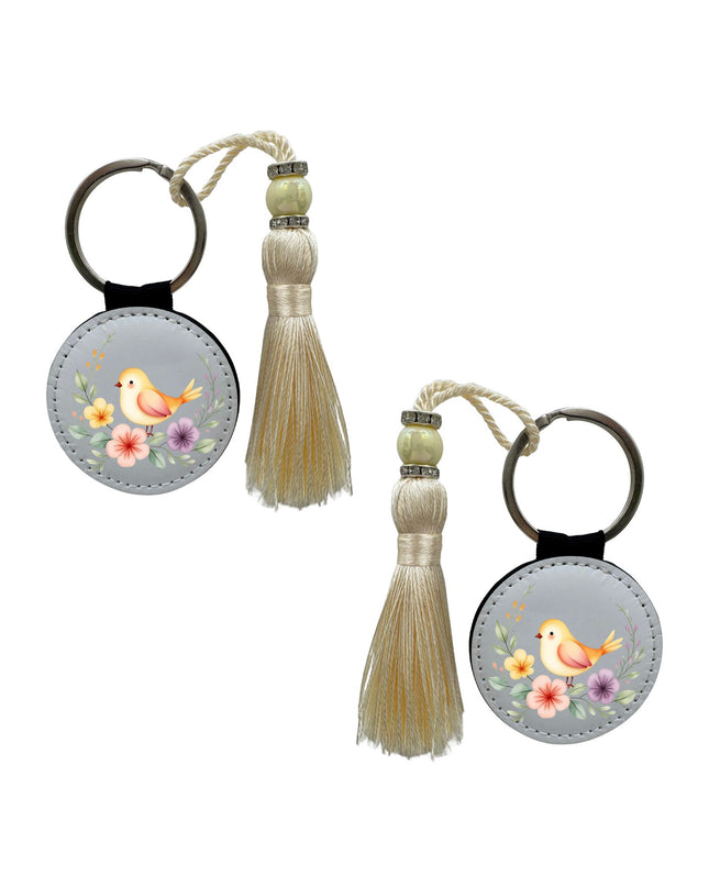 Two keychains with tassels on a white background