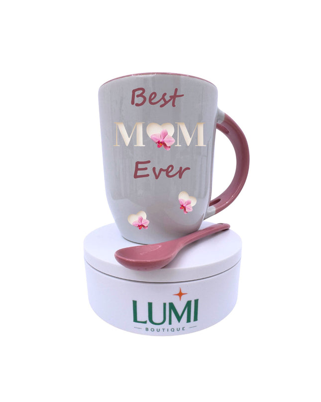 Mug with 'Best Mom Ever' text and pink spoon on a white background, featuring Lumi Boutique branding.