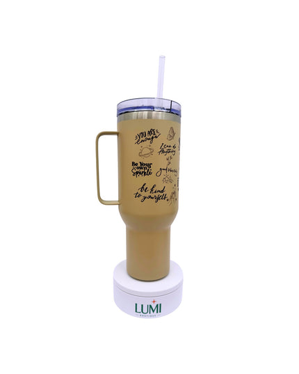 Beige tumbler with handle and straw on a white background, featuring the LUMI brand.