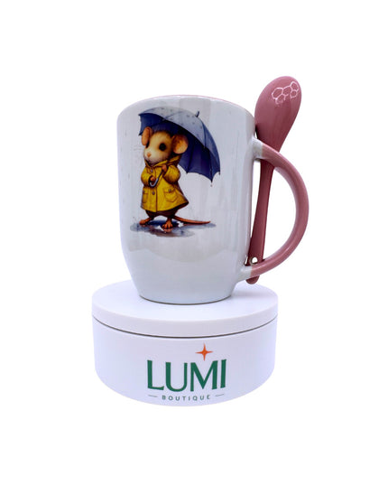 Mug with a character holding an umbrella and a pink spoon, branded 'LUMI Boutique', on a white background.