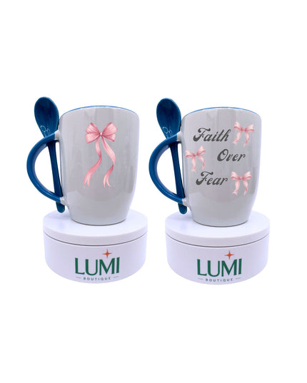 Two mugs with blue handles and pink bows on a white background, featuring the brand 'LUMI'.
