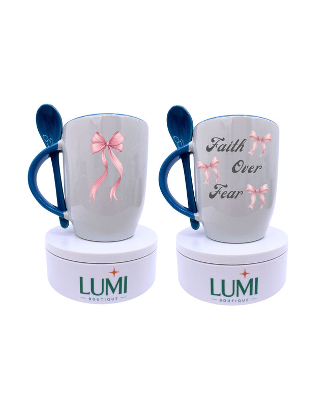 Two mugs with blue handles and pink bows on a white background, featuring the brand 'LUMI'.