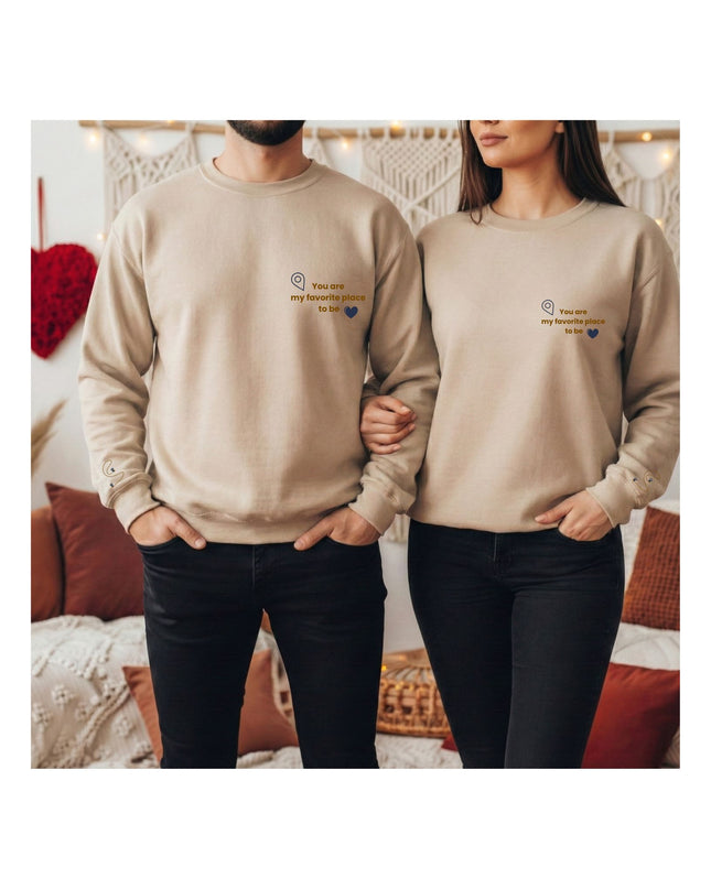 beige sweatshirts with text and heart designs.