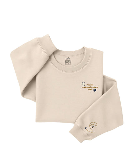 Beige sweatshirt with text and logo