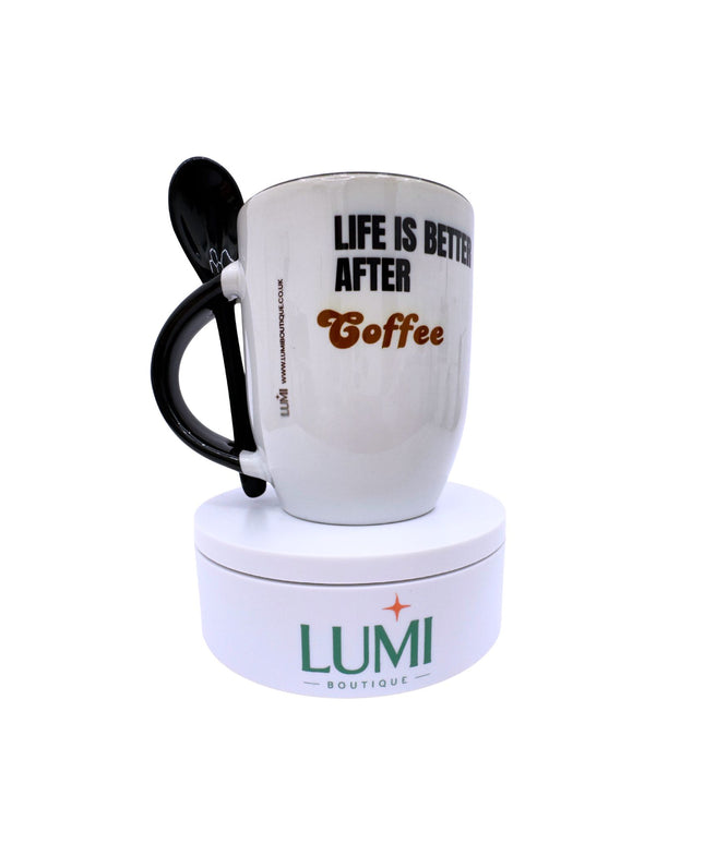 White mug with black handle and text 'Life is better after Coffee' on a white background, featuring the Lumi Boutique logo.