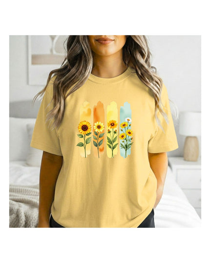 a yellow t-shirt with floral designs 