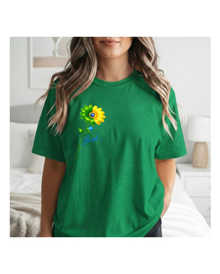 a green t-shirt with a colorful graphic design i