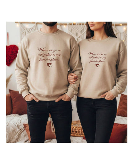 beige sweatshirts with a heart design and text.