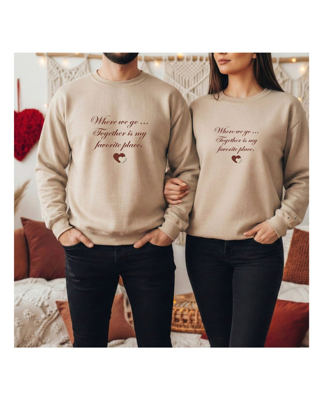 beige sweatshirts with a heart design and text.