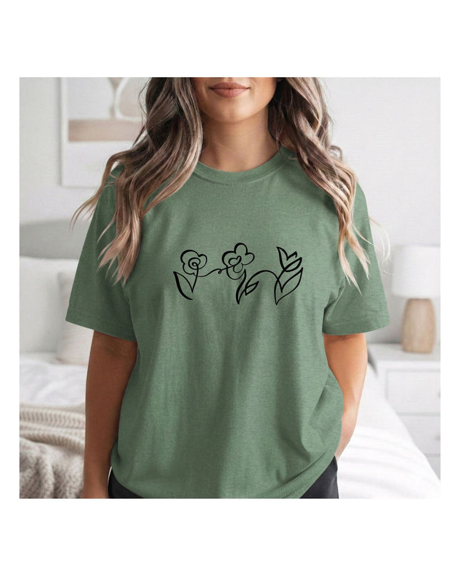 a green t-shirt with black floral designs 