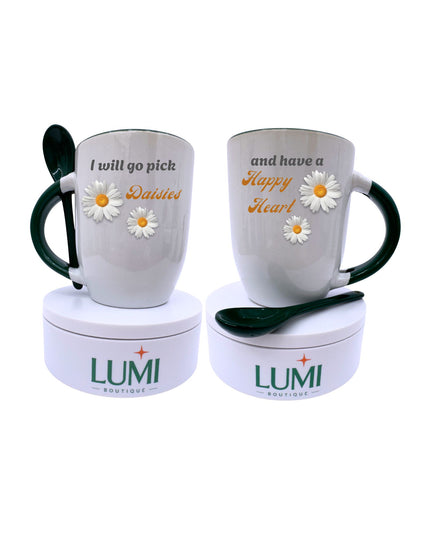 Two mugs with floral designs and text, each on a matching container with 'LUMI' branding.