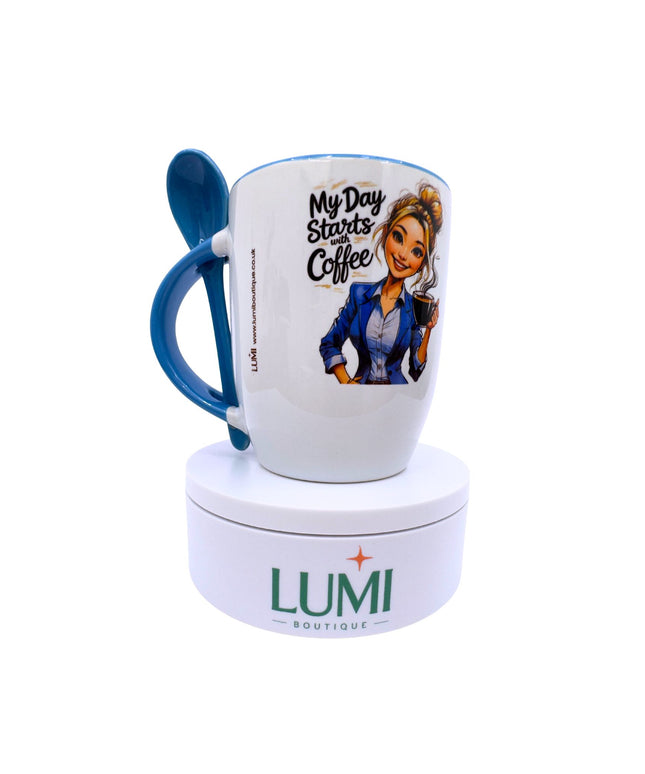 White mug with blue handle featuring a cartoon character and text, on a white stand with 'LUMI Boutique' branding.