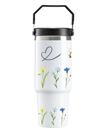 White tumbler with floral designs and a heart symbol on a white background