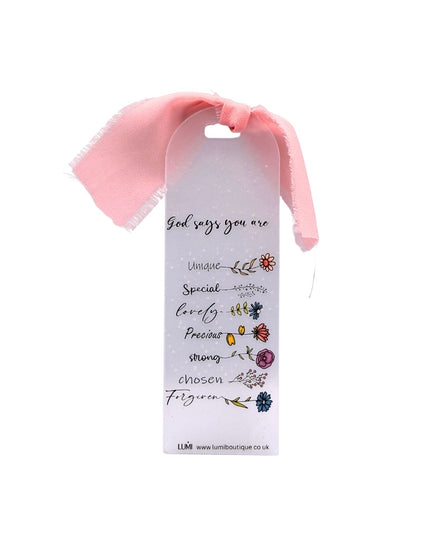 Pink headband with a motivational message tag on a white background