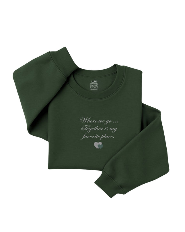 Green sweatshirt with text and heart design 