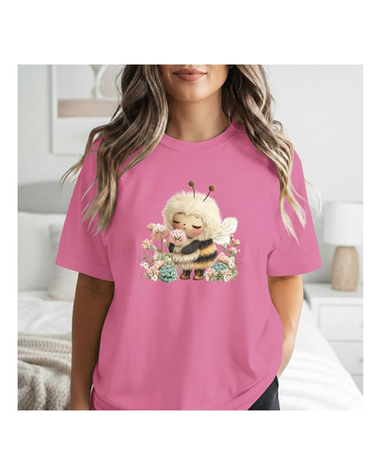 a pink t-shirt with a cartoon bee design 