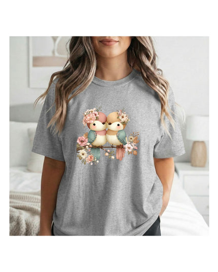  a gray t-shirt with a graphic design of two birds and flowers 