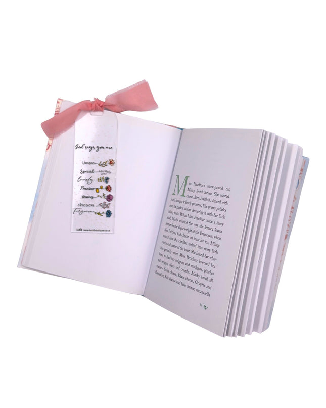 Open book with decorative elements on a white background