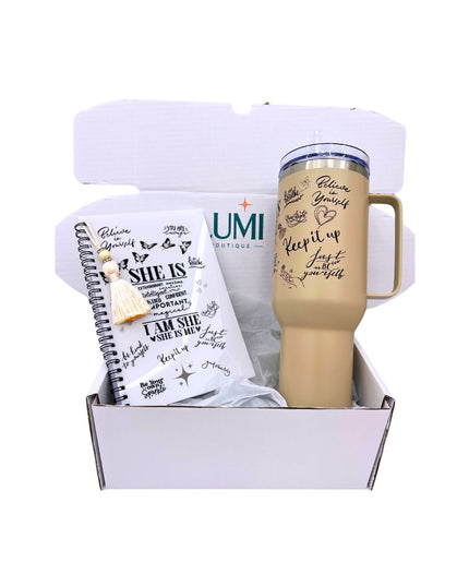 Gift set with a tumbler and notebook in a box on a white background