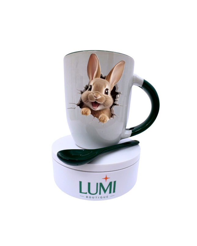 Mug with rabbit design and matching spoon on a white background, featuring the brand 'LUMI'.