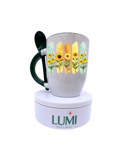 Mug with floral design on a white background, featuring the LUMI Boutique logo.
