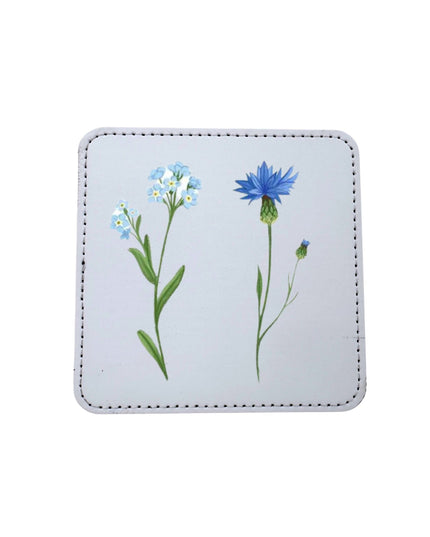 Square coaster with floral design on a white background