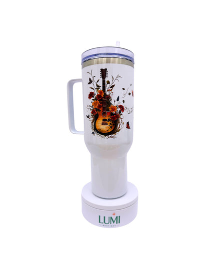 Tumbler with guitar and floral design on a white background, featuring the LUMI brand.