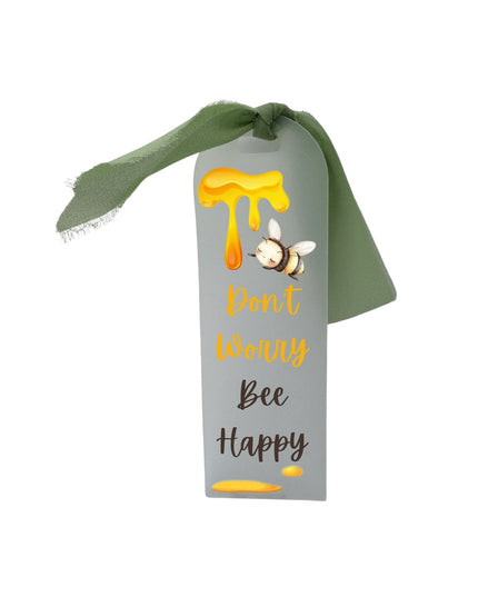 Decorative ribbon with a bee and honey design on a white background