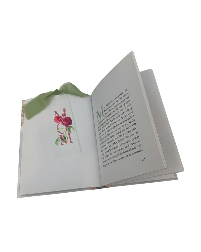 Open book with floral design on a white background