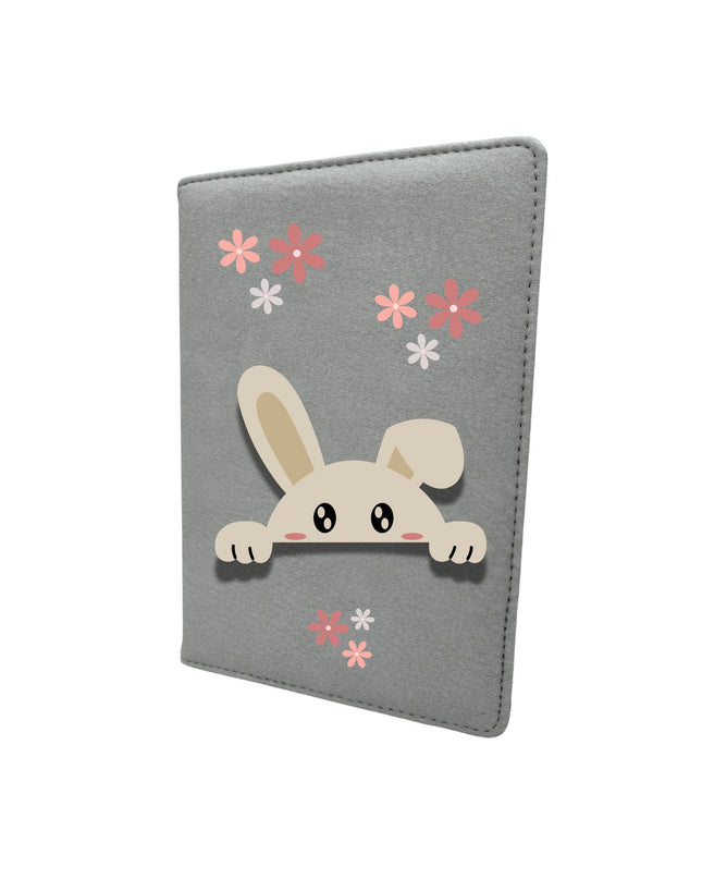 notebook with a cartoon bunny and flowers on a white background