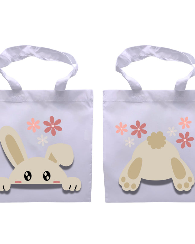 Two white tote bags with cartoon bunny illustrations and floral designs on a white background