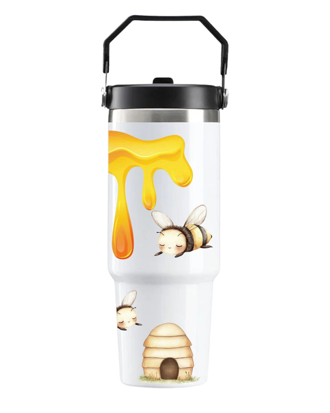 Tumbler with bee and honey design on a white background