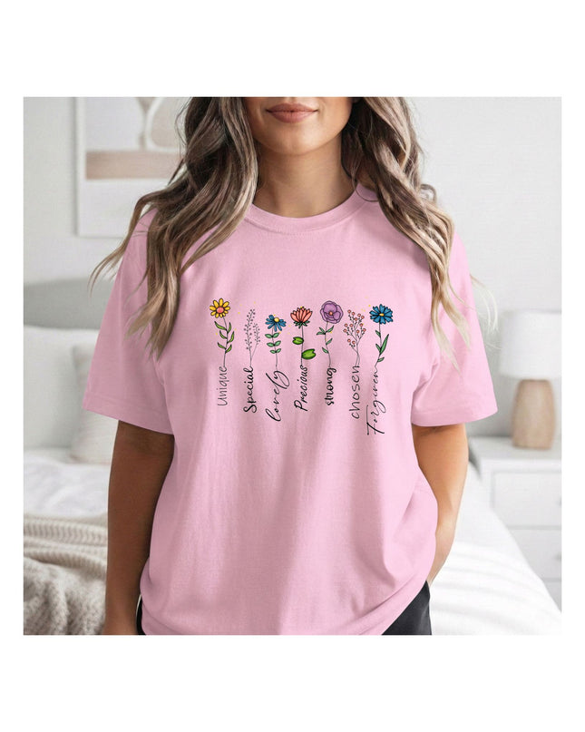  a pink t-shirt with a colorful design and text.