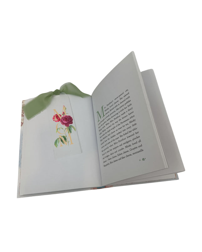 Open book with floral illustration on a white background