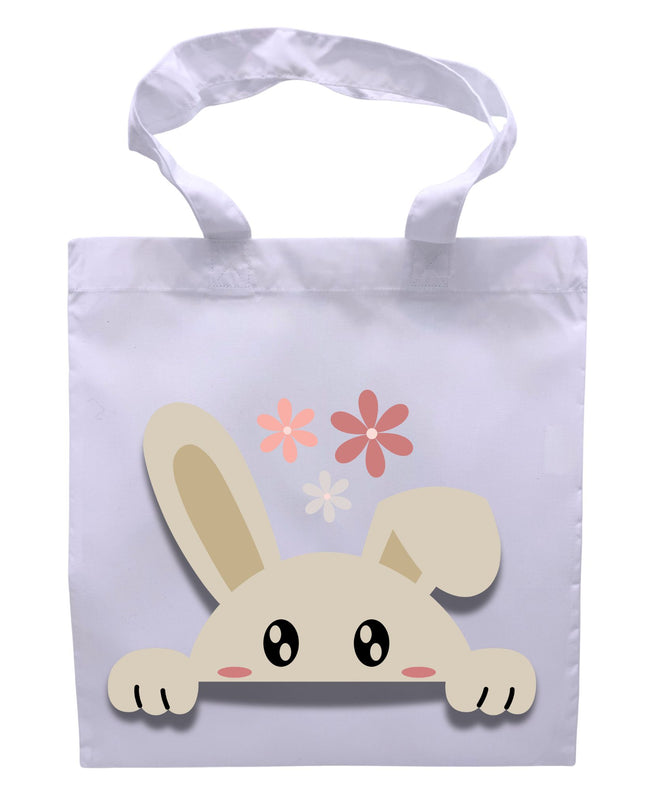 White tote bag with a cartoon bunny design and flowers on a white background